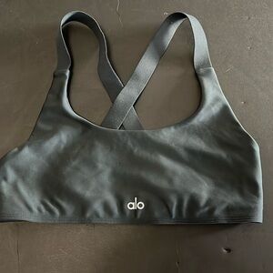 alo yoga top. Size “M” stretch fabric. Solid black. Wonderful condition